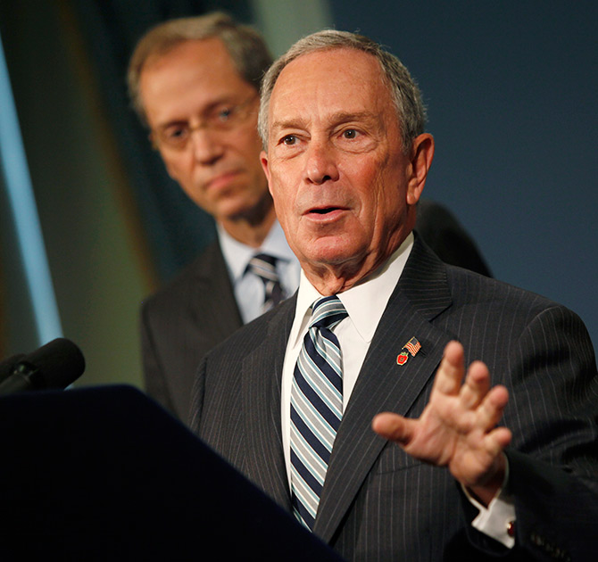 Michael Bloomberg (R) speaks alongside New York City Health Commissioner Thomas A. Farley at a news conference.