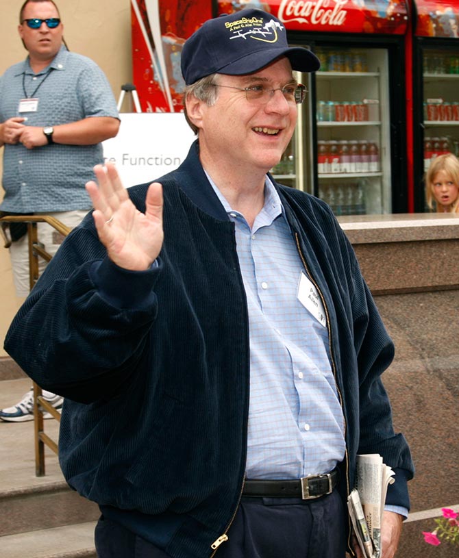 Microsoft co-founder Paul Allen waves during lunch at the Allen and Co. conference at the Sun Valley Resort in Idaho.