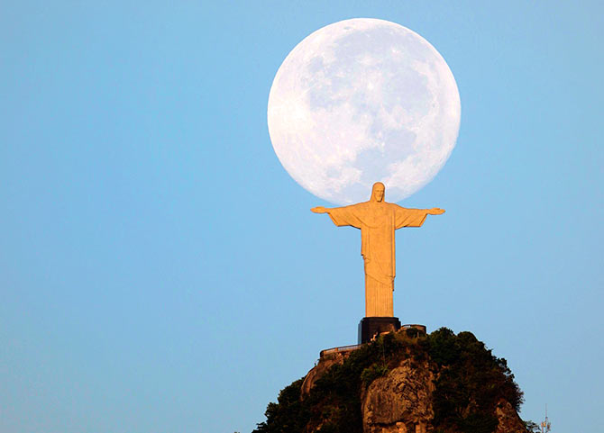 A full moon is seen over the Christ the Redeemer statue in Rio de Janeiro.