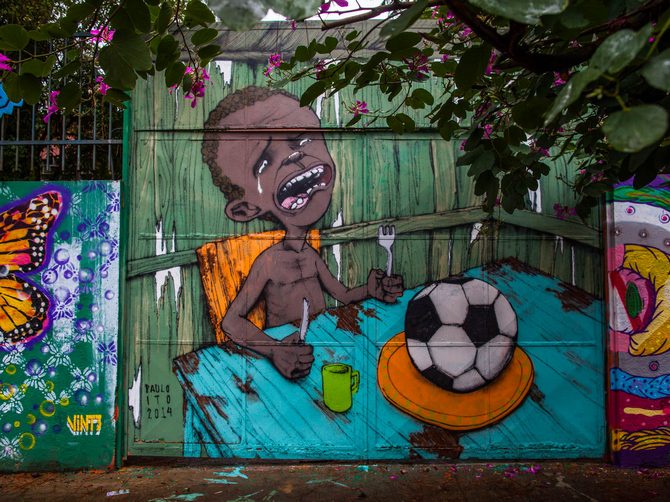 Graffiti on a wall of a public school criticises the hosting of the World Cup in Sao Paulo, Brazil.