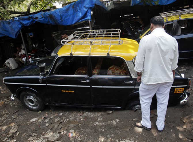 A potholed Mumbai road. Photograph: Vivek Prakash/Reuters