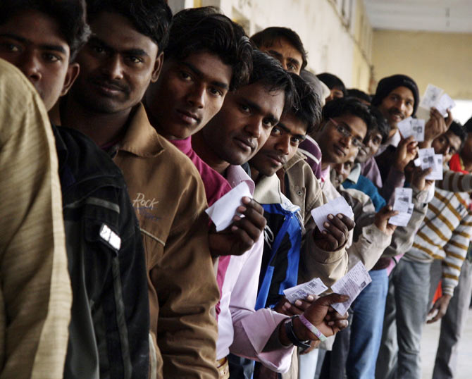 Voters wait to cast their ballots in Gorakhpur, Uttar Pradesh.