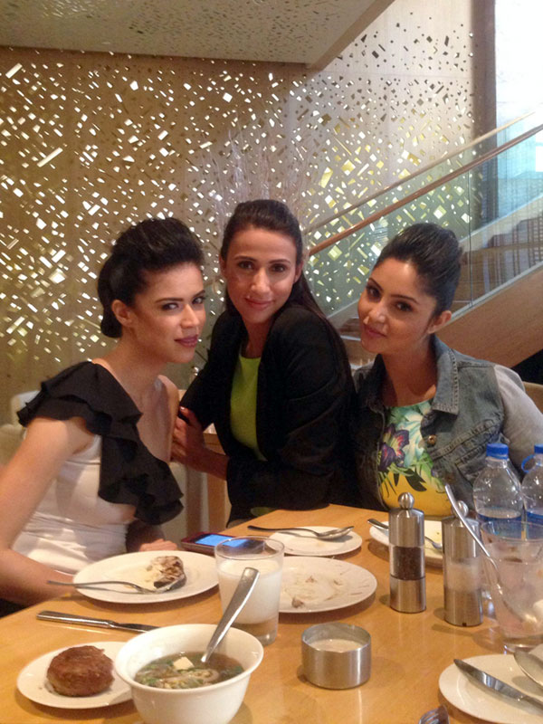 Happy times: Alesia Raut bonds with her model friends over lunch.
