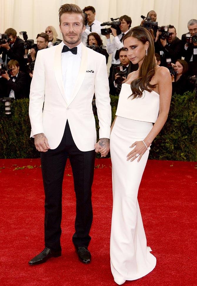 David Beckham (L) and Victoria Beckham