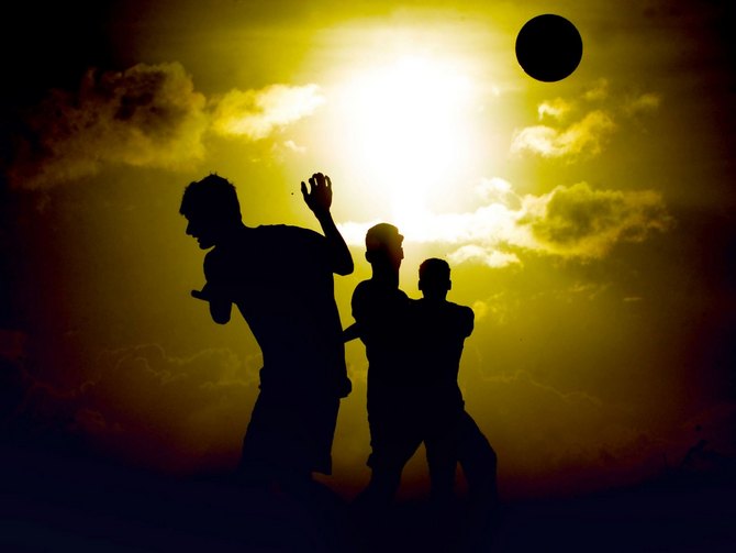 Friends enjoy a game of soccer as the sun sets in the background. Image used here for representational purposes only.