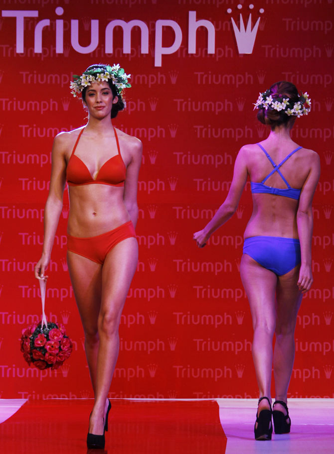 Models walk the runway in Triumph creations.