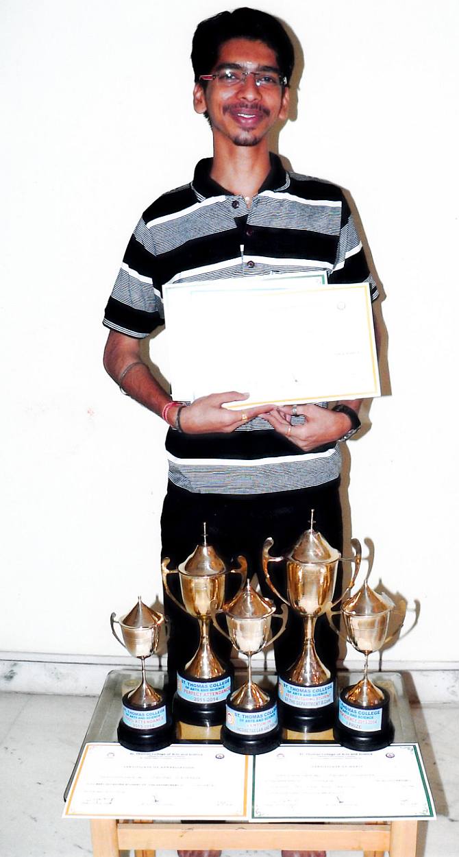 Abhilash Vidyakar with his trophies at Udavum Karangal