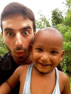 Zubin Sharma poses with a young kid 