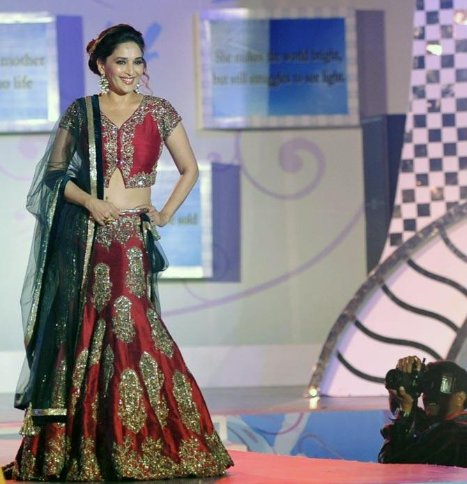 Madhuri Dixit in a red lehenga by Manish Malhotra