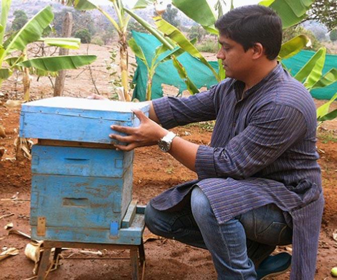 Shrikant Gajbiye explains the process of bee keeping