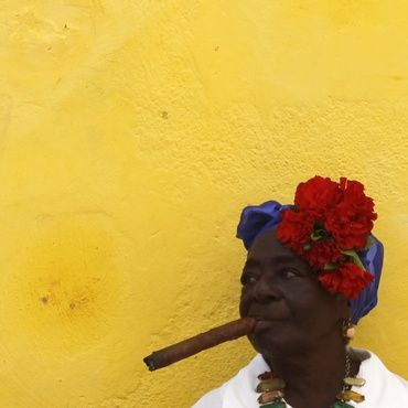 A lady enjoys a cigar in Cuba