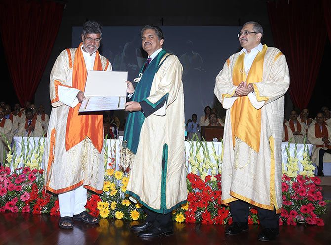 (LtoR) Kailash Satyarthi felicitates Anand Mahindra in the presence of Devang Khakhar