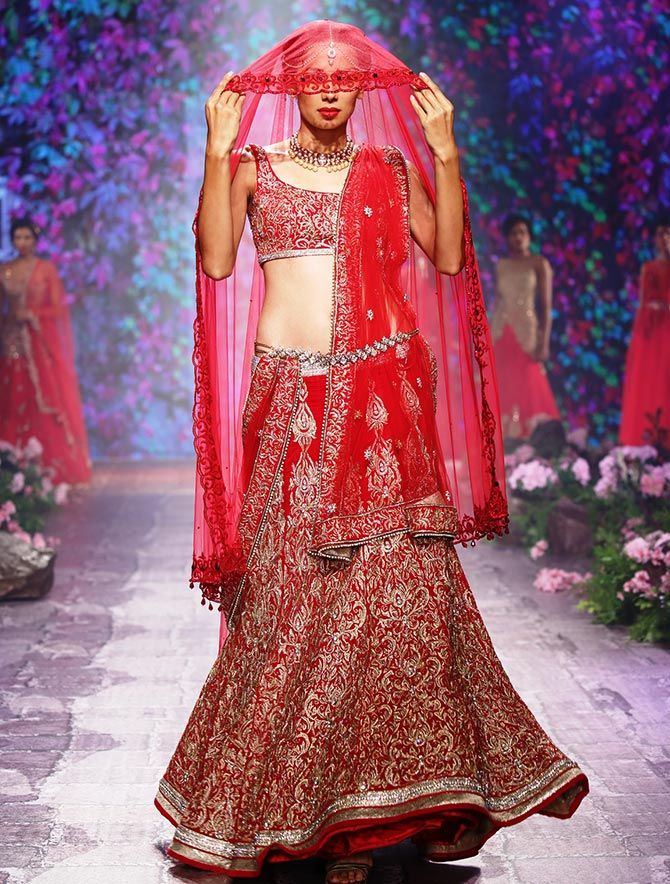 A model walks the ramp in a Jyotsna Tiwari creation at the BMW India Bridal Fashion Week 2015.