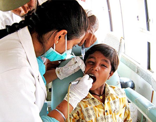 Dr Preeti attends a kid in the mobile van