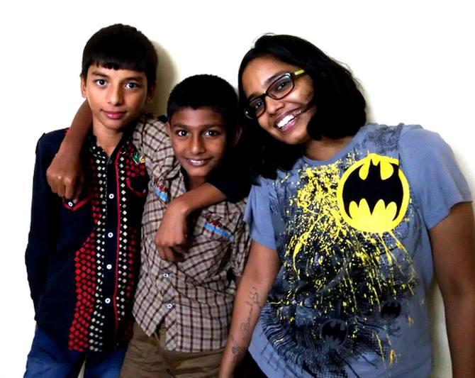 Aman (center), flanked by Mohini (right) and a classmate