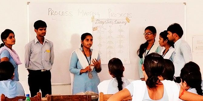 Students engage in a discussion at Medha
