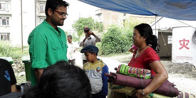 Rajat Dhariwal interacts with a family in Nepal