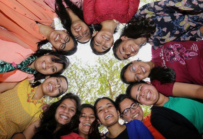 Students celebrate their success after announcement of CBSE class 12th results at a school in Gurgaon on Monda