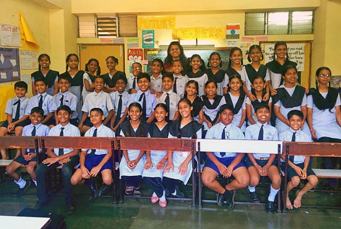 Angeline (top row, centre) with her students