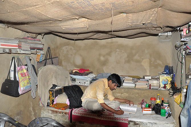 Anup Raaj studies in his clay house