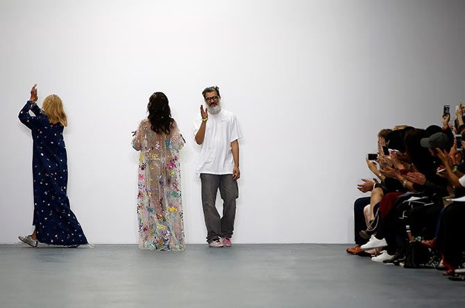 Ashish Gupta walks at the end of his show at London Fashion Week