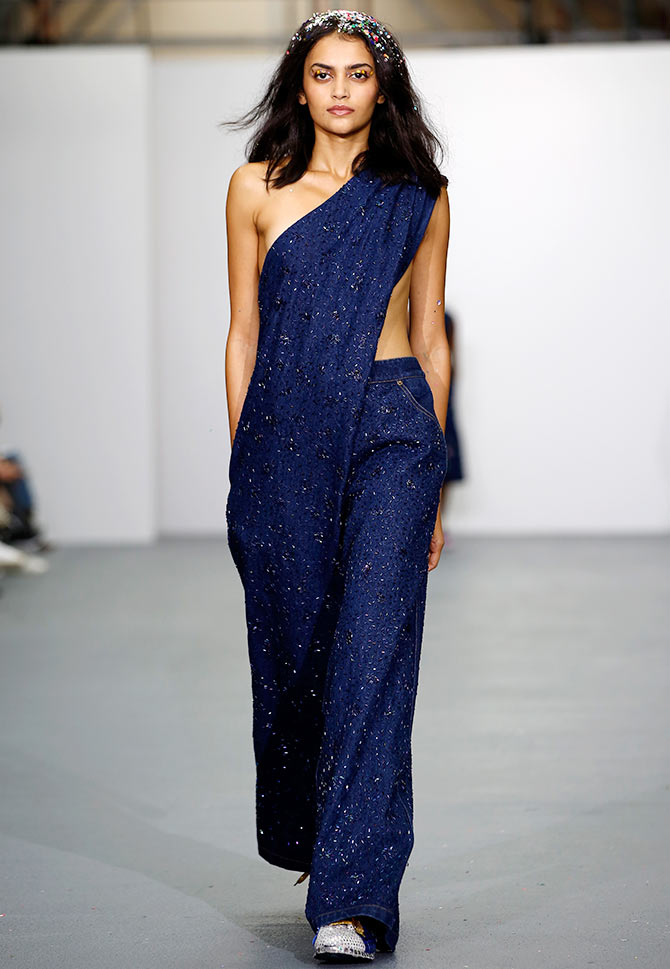 Natasha Ramachandran walks in an Ashish Gupta creation at London Fashion Week