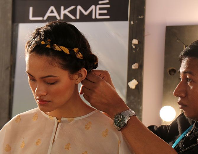 Suzanne gets her hair done prior to a show at the ongoing Lakme Fashion Week in Mumbai.