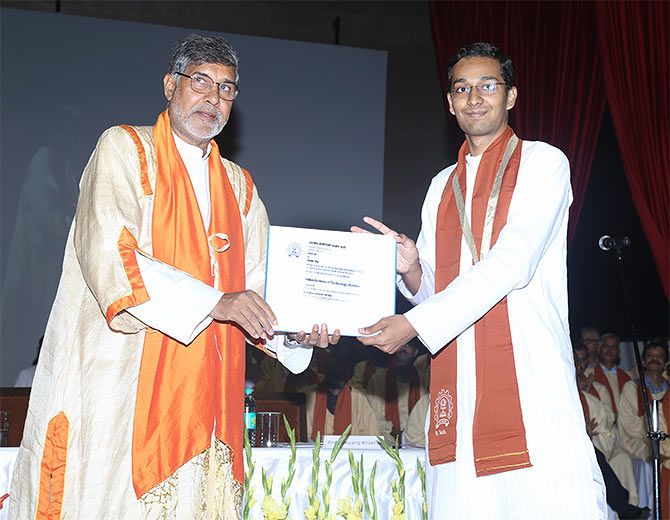 Kailash Satyarthi, Nobel Peace Prize Laureate, who was the chief guest at the 53rd Convocation ceremony at IIT-B, gives a graduation certificate to a student in this file photo