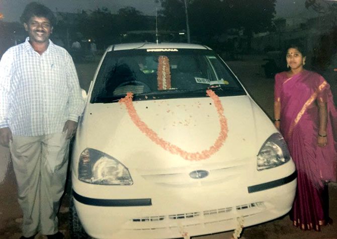 Renuka with his wife and the first car he bought.