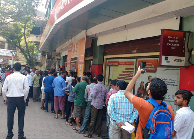 A long queue of people standing outside ICICI Bank's Malad West branch. There were two separate queues: One for exchanging notes and other for depositors