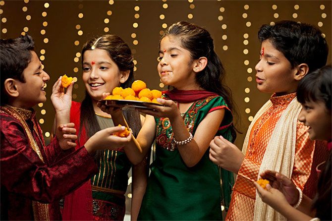 Children enjoying Diwali sweets