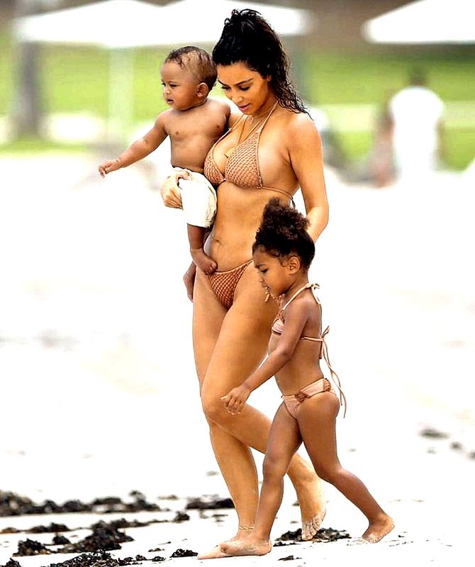 Kim with kids in a bikini