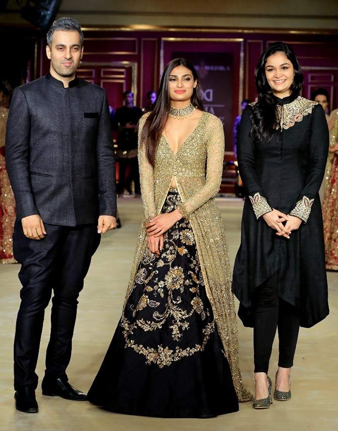 Athiya Shetty flanked by designers Shyamal and Bhumika