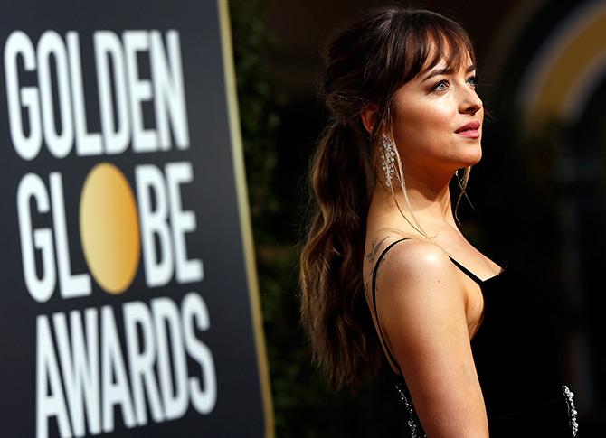 Hollywood star Dakota Johnson on the Golden Globes red carpet wearing Nirav Modi' Nirav Modi's cascade earrings. Photograph: Mario Anzuoni/Reuters.