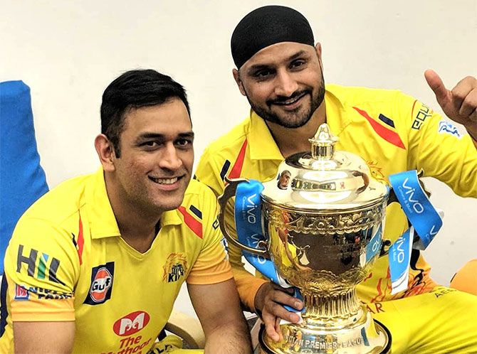 Mahendra Singh Dhoni and Harbhajan Singh celebrate Chennai Super Kings' IPL victory last season