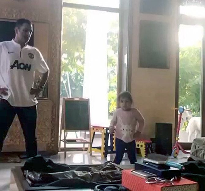 Dhoni matches steps with Ziva as she dances to her favourite song.