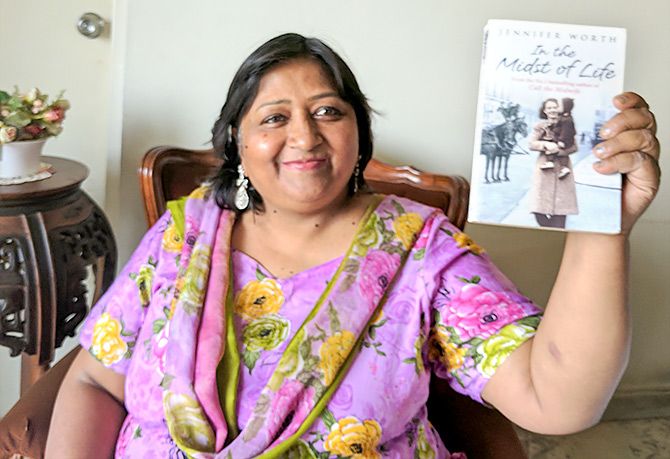 Heera Nawaz with the book In the Midst of Life by Jennifer Worth
