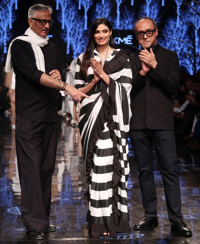 Athiya Shetty with designers Abraham and Thakore