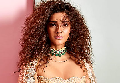 Stunner! Sonam rocks curly hair and plunging neck - Rediff.com