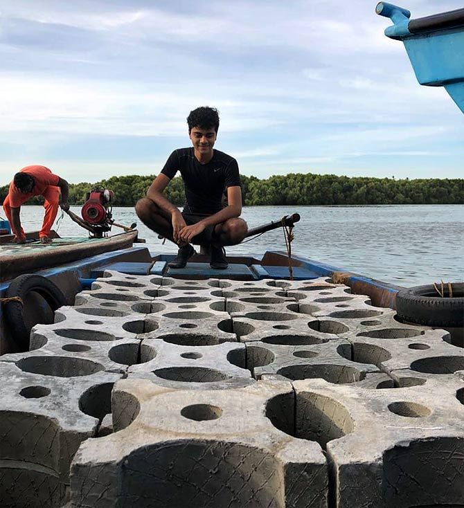 Siddharth Pillai with the artificial reefs made from cement dolomite before they were dropped into the sea in Puducherry. Photographs: Kind courtesy Siddharth Pillai
