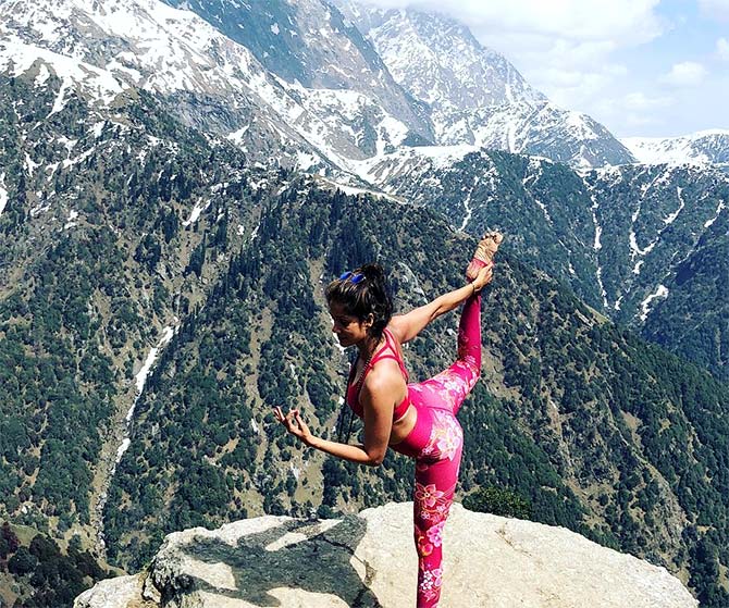 Pics: Vidya Malavade attempts yoga on mountain top - Rediff.com