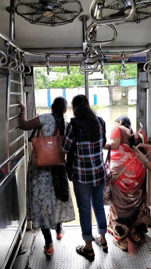 Women passengers peer out of a local train compartment on September 4, 2019. We could see snakes in the water around the tracks. Photographs: Divya Nair/Rediff.com