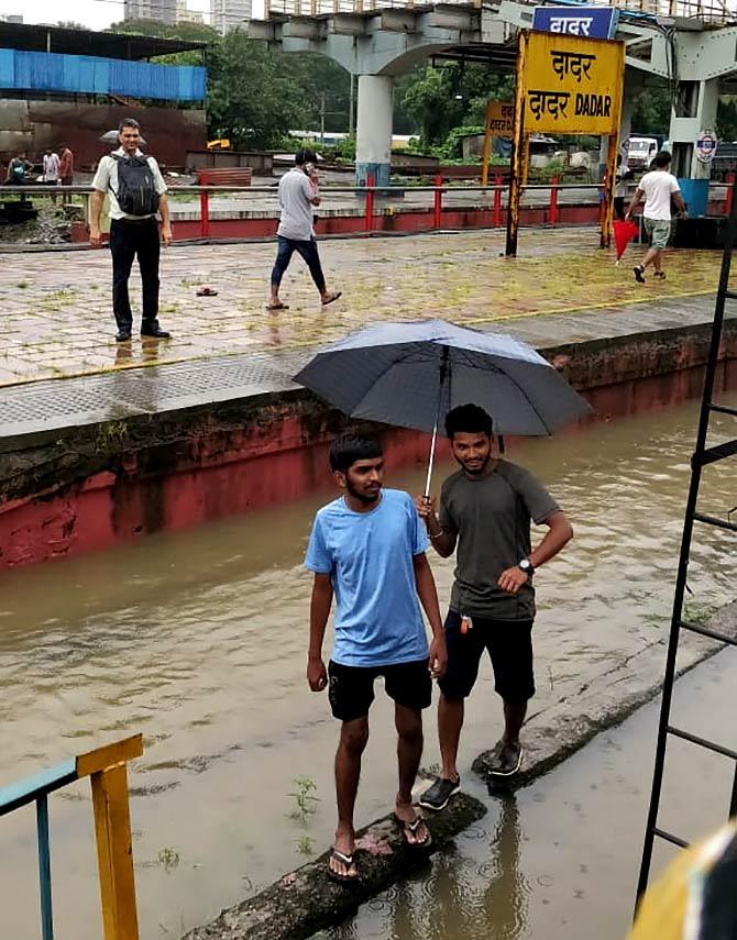 Stranded commuters looking for help at Dadar station, north central Mumbai.