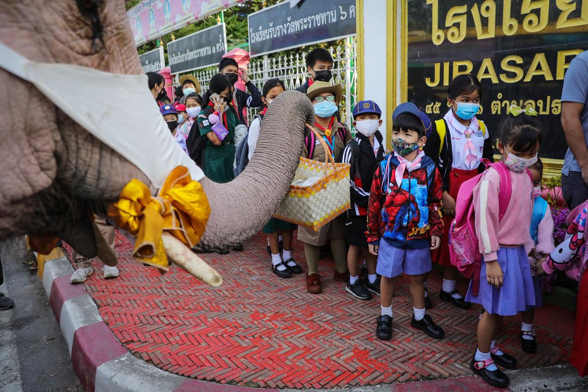 Santa Claus in Thailand delivers face masks ahead of Christmas