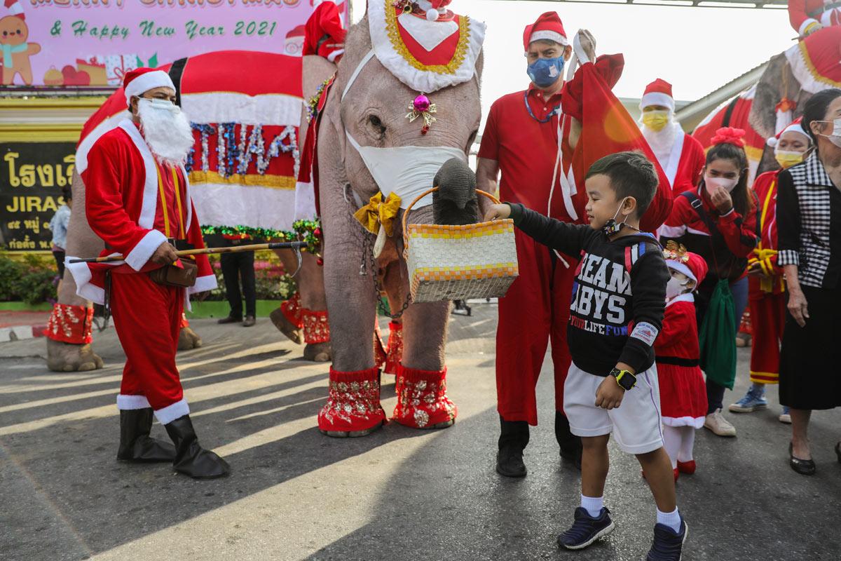 Santa Claus in Thailand delivers face masks ahead of Christmas