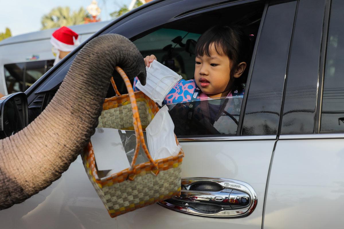 Santa Claus in Thailand delivers face masks ahead of Christmas