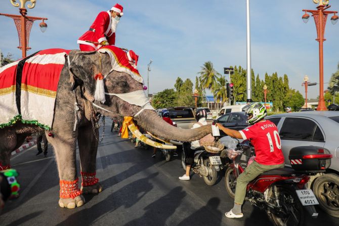 Santa Claus in Thailand delivers face masks ahead of Christmas
