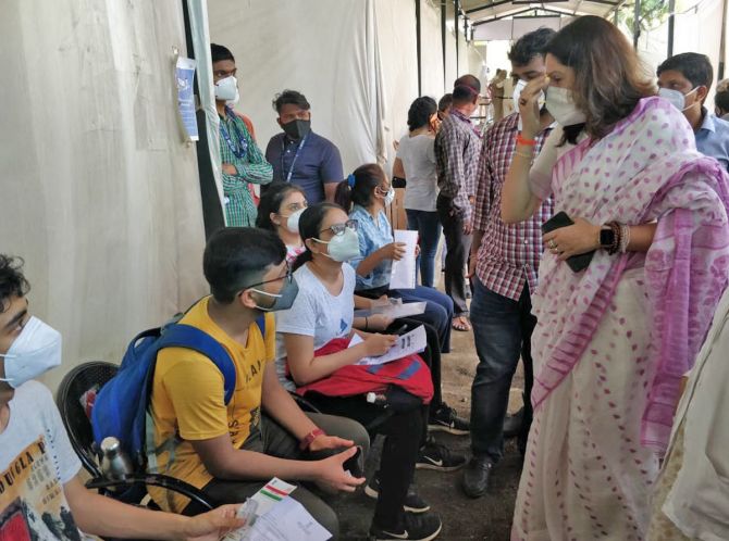 Students wait to get jabbed at Cooper hospital in Mumbai