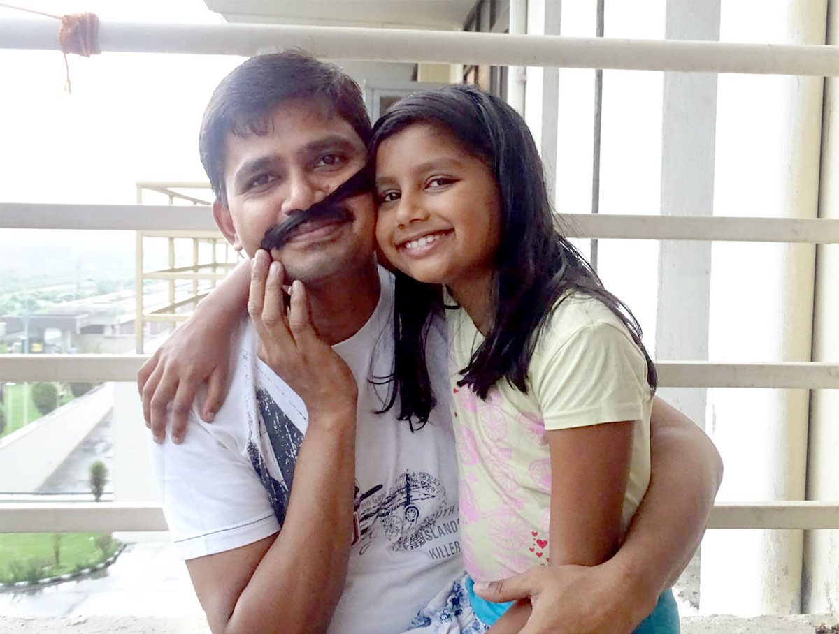 M Sahana with her father S Muthu Kumar