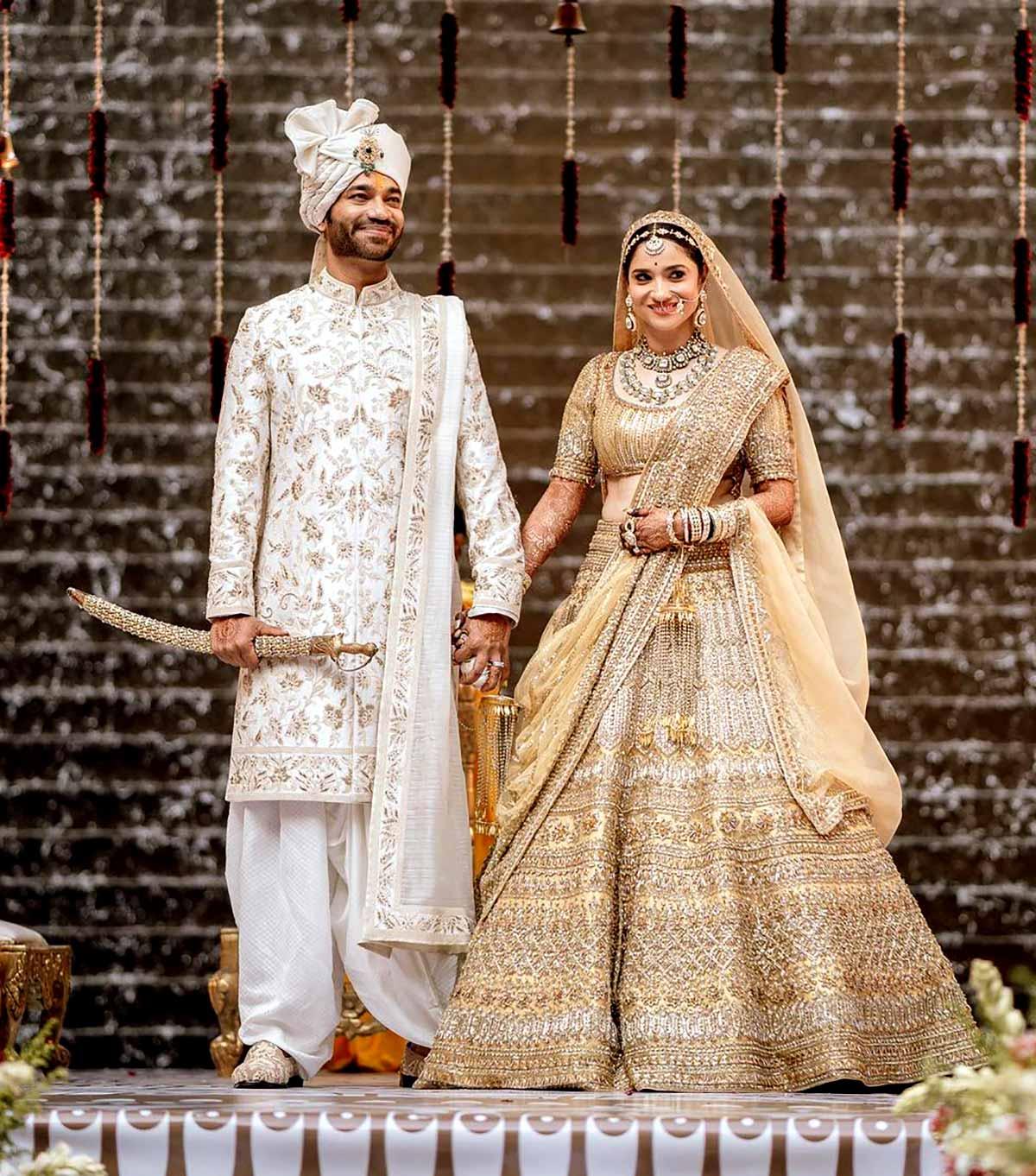 Photo of Red and gold bridal lehenga heavy by Manish Malhotra